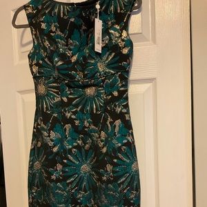 Trina Turk. Size 0 BNWT. Knee length. Black blue floral design.